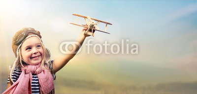 Freedom To Dream - Joyful Child Playing With Airplane Against The Sky
