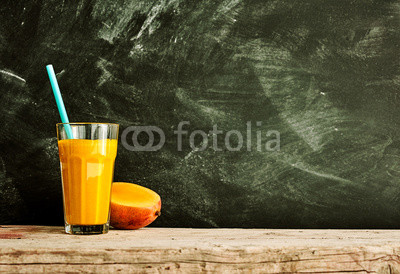 Bright mango fruit smoothie with copy space