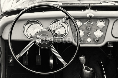 Steering wheel and dashboard in historic vintage car
