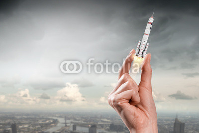 Hand giving rocket . Mixed media