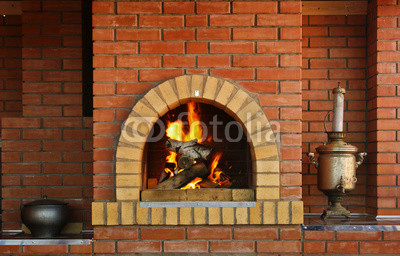 Russian interior kitchen with an oven and a burning fire