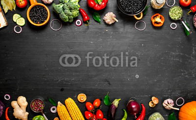 Frame of organic food. Fresh raw vegetables with black beans.