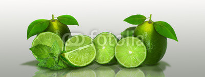Sliced and whole limes in a panoramic