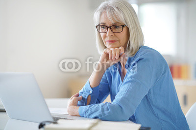 Senior businesswoman working in office