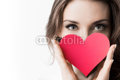 Girl holding paper heart
