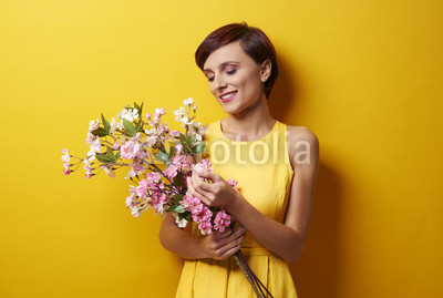 Bunch of flowers delighted woman