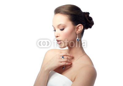 beautiful woman with earring, ring and pendant