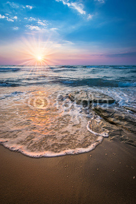 Sunray over sea in Tuscany