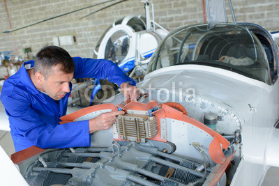 Mechanic working on aircraft
