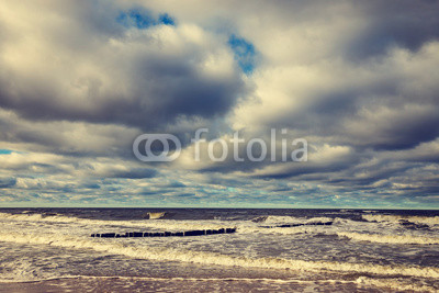 Sandy yellow beach with cloudy sky, Baltic Sea