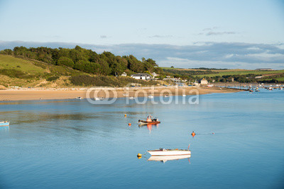 View of the Camel estuary at low tide with the touristic village Rock in Cornwall. View from Padstow on the opposite site of the estuary.