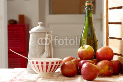 bottle of cider with fresh apples