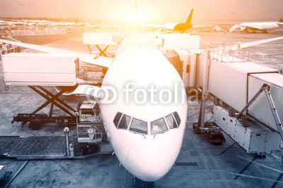airport with crowded airplanes with sunbeam