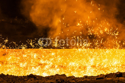 iron stream and sparks at a metallurgical plant