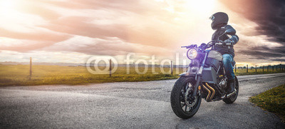 motorbike on the road riding. having fun riding the empty road on a motorcycle tour / journey