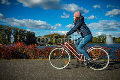 Girl biking in city 