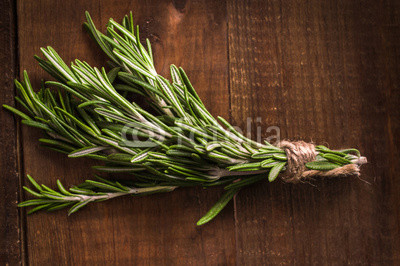 Rosemary on a wooden background