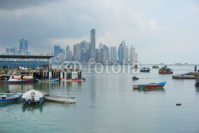 Panama city fishing harbor wharf and boats with skyscrapers buildings in background, Pacific coast of Panama, Central America