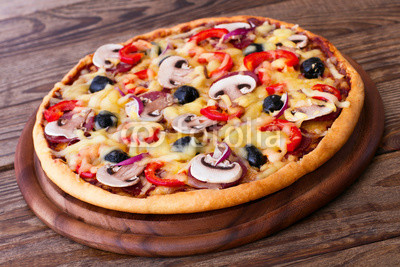 Pizza with seafood on wood table