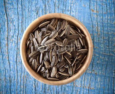Sunflower seeds in wood bowl