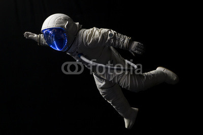 astronaut in space mission in the dark and space