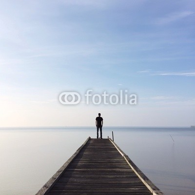people standing on jetty
