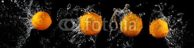 Set of fresh oranges in water splash