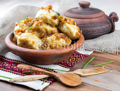 Ukrainian dumplings with cabbage, cheese and cherries