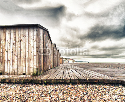 Wooden cabins along a beautiful beach