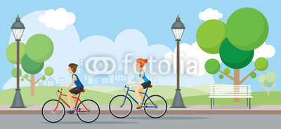 Couple Riding Bicycles In Public Park
