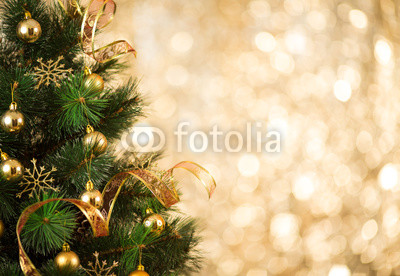 Christmas tree background with gold blurred light