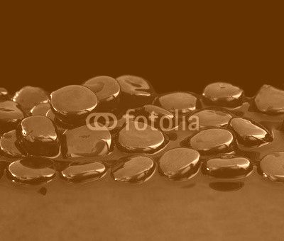 Black stones on calm water background