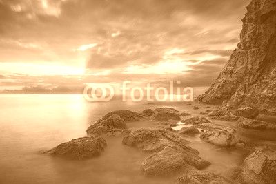 Sunset panorama over sea and rocks