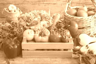 Vegetables in basket on wooden table