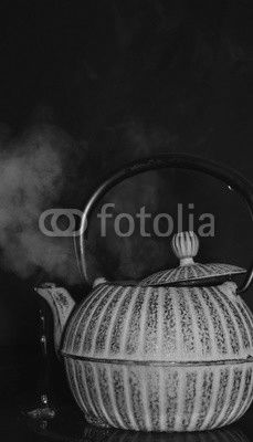 the kettle on the stove on a black background