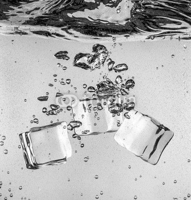 Ice cubes falling under water