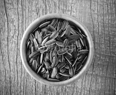Sunflower seeds in wood bowl
