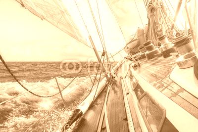 sail boat navigating on the waves