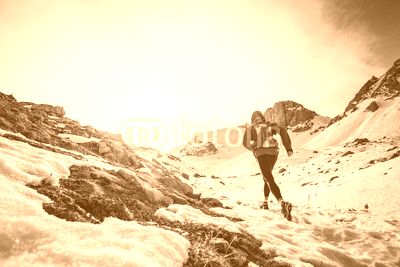 Man running on the snow on a mountain