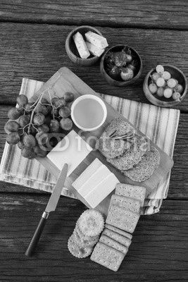 Gouda cheese, brown bread slices, lime juice biscuits and fruits