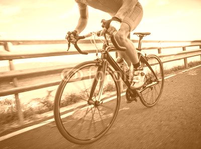 Detail of a road bike with a cyclist pedaling