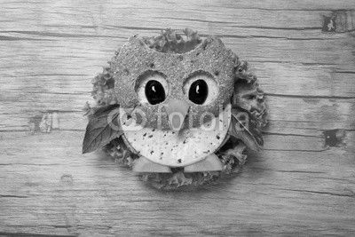 Owl made of bread and cheese on wooden background