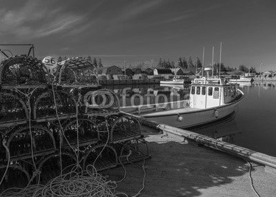 Commercial fishing boats at a wharf in rural Prince Edward Island, Canada.