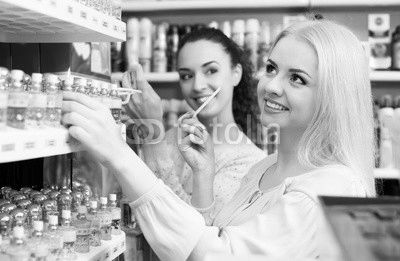 Female friends buying perfume