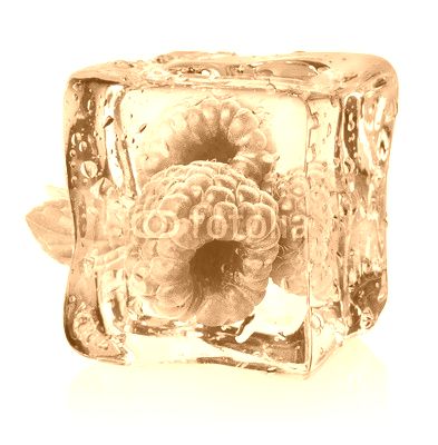 Ice cube and raspberries isolated