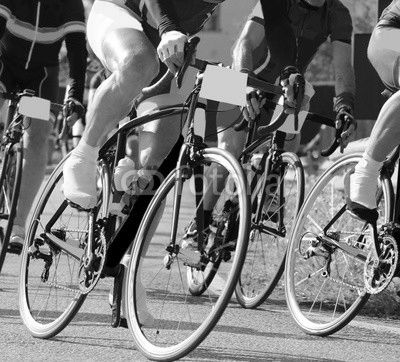 fast cyclists on racing bikes run during the sports competition