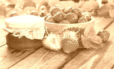 Strawberry on wood background. Strawberry with green leaves.