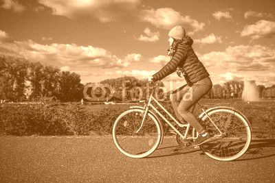 Girl biking in city 