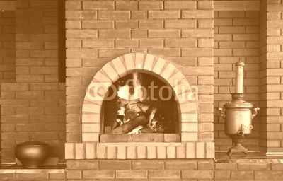 Russian interior kitchen with an oven and a burning fire