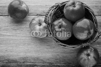 Ripe red apples on wooden background.